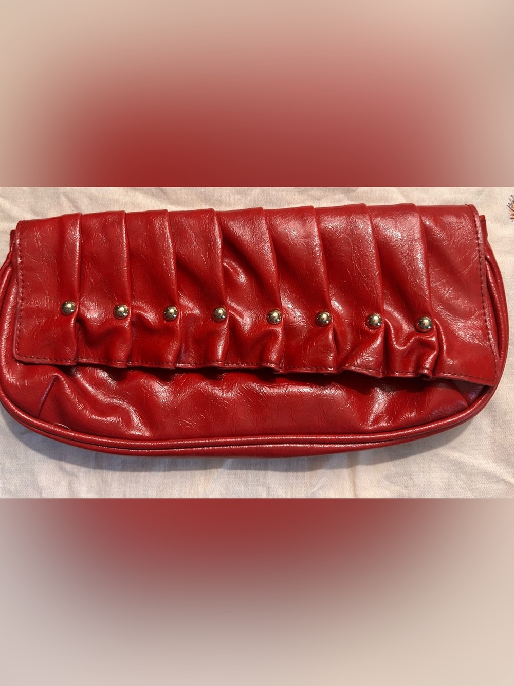Unlisted Red Pleated Clutch with Gold Studs